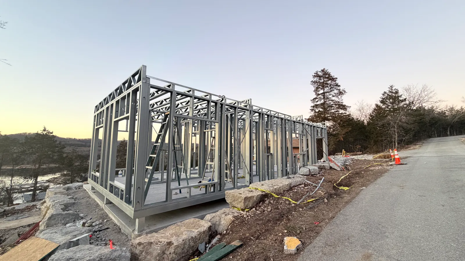 Light-steel module frames of the Missouri residences erected on prepared lakeside foundations