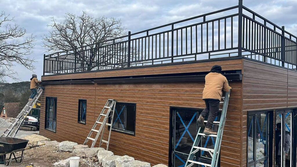 Real steel-frame building exterior cladding installation for workshop and garage planning